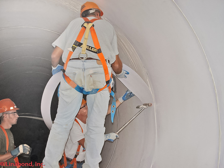 Applying Linabond PVC Joint Overlay to Wall of Lined Pipe